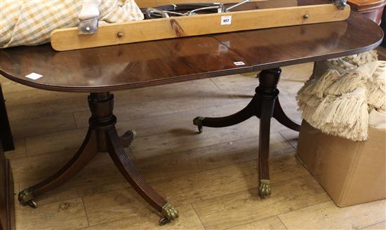 A mahogany twin pillar table, with one leaf, W.160cm